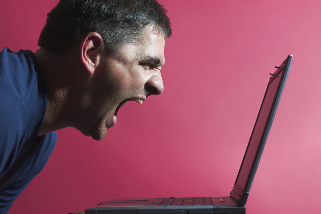 Blogger yelling into a computer