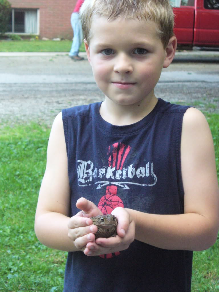 Aiden holding a frog