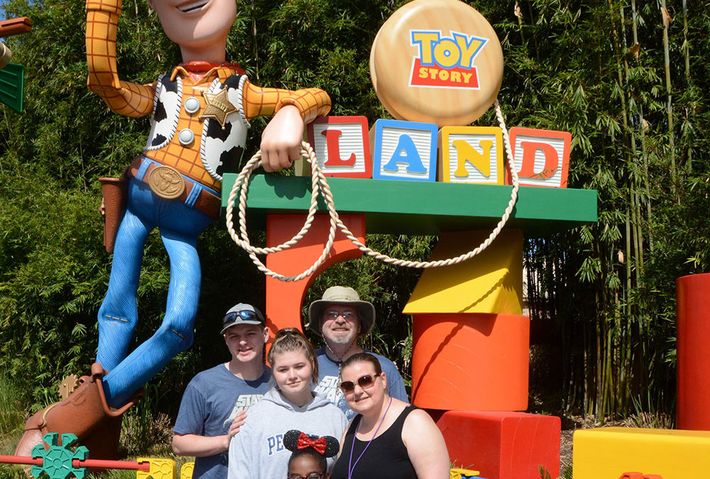 Posing with Woody at the entrance to Toy Story Land in Disney's Hollywood Studios
