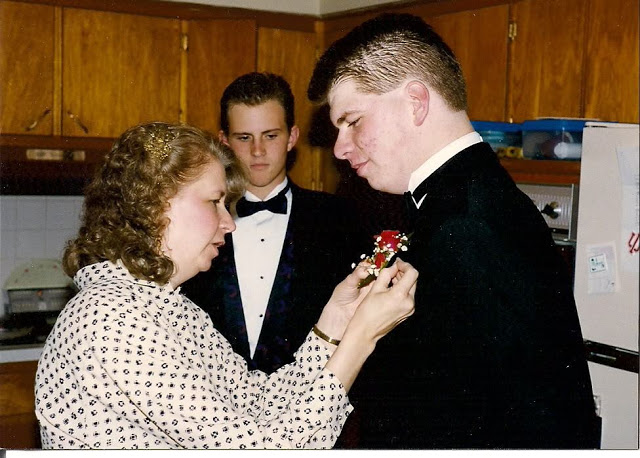 Mom pinning my boutonniere before Junior Prom. 